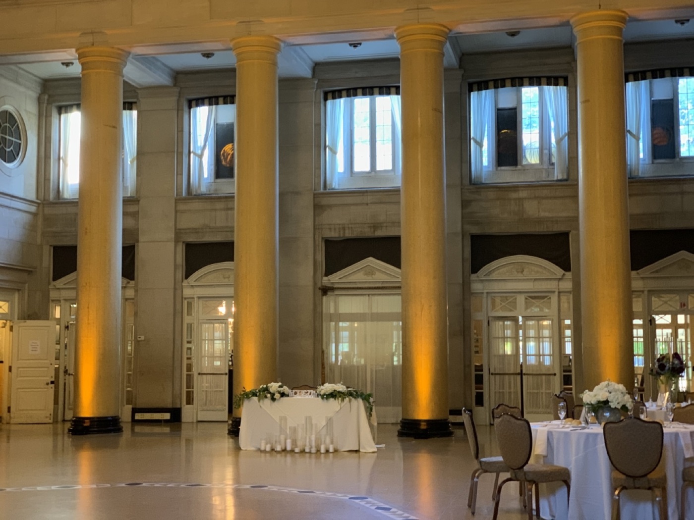 A banquet ballroom with warm accent lighting