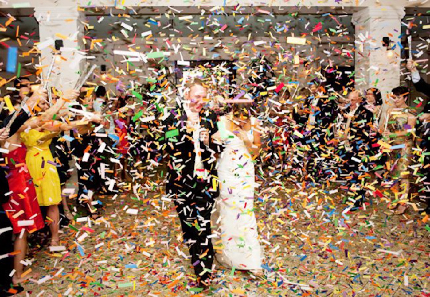 A couple surrounded by confetti on the dance floor